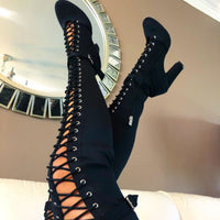 Chunky heel closed toe over-the-knee dance boots with street sole.