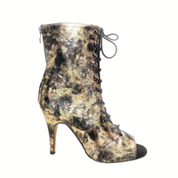 Sofiya Latin dance booties in gold and black with cutout design.