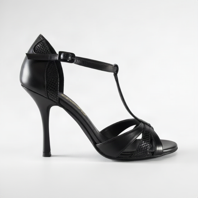 A black high-heeled T-strap sandal with textured panels and an ankle strap, shown from a side profile on a white background.